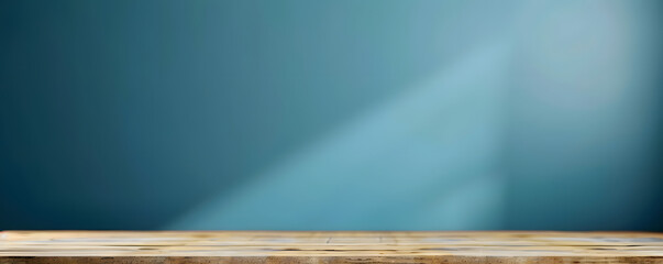 Empty wooden table over blue wall background, product display montage.