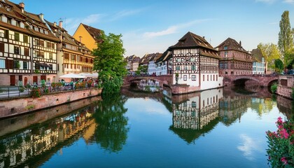 Obraz premium Le Petite France, the most picturesque district of old Strasbourg. Half-timbered houses with reflection in waters of the Ill channels.