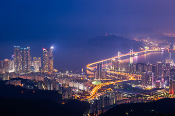 Fototapeta premium Busan city and skyscrapers in Haeundae district, Gwangan Bridge, skyscrapers and Busan sea, Busan South Korea.