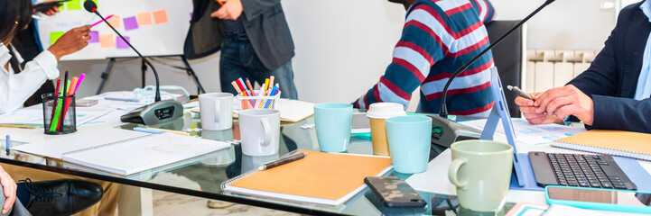 desk office with laptop, blank notepad, coffee cup, mug and pen on glass table - Business table in finace office – paper office and document on top desk –horizontal web banner size for header 