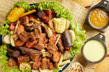 roasted meats to share in a typical rustic style top view