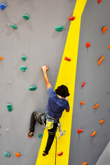 Athletes training on climbing wall