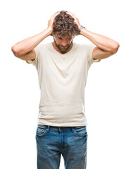 Fototapeta premium Handsome hispanic model man over isolated background suffering from headache desperate and stressed because pain and migraine. Hands on head.