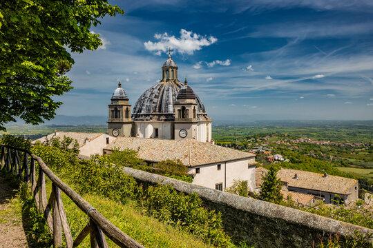 A glimpse of the ancient medieval village of Montefiascone, Viterbo, Italy. The Cathedral of Santa Margherita, with its large dome and the two bell towers, with clocks, on the sides.