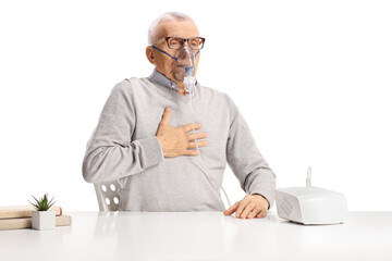 Elderly man with breathing problem using a nebulizer