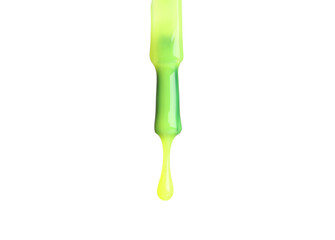 Bright nail polish dripping from brush isolated on white