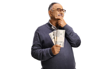 Happy mature man holding money and thinking