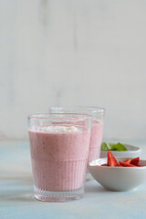 Healthy summer strawberry smoothie with yogurt and coconut