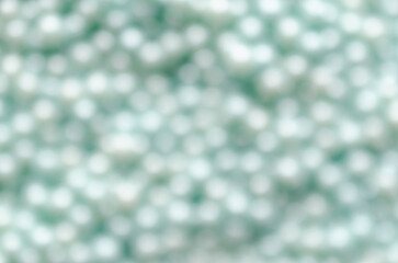 Abstract background of blurred light blue pearls. 