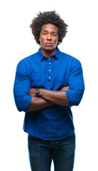 Afro american man over isolated background skeptic and nervous, disapproving expression on face with crossed arms. Negative person.