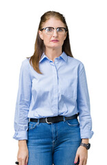 Beautiful middle age mature business woman wearing glasses over isolated background Relaxed with serious expression on face. Simple and natural looking at the camera.