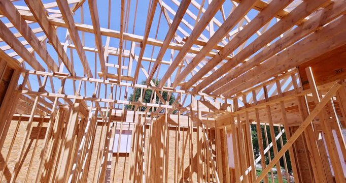 An under construction timber truss framed house with roofing joints
