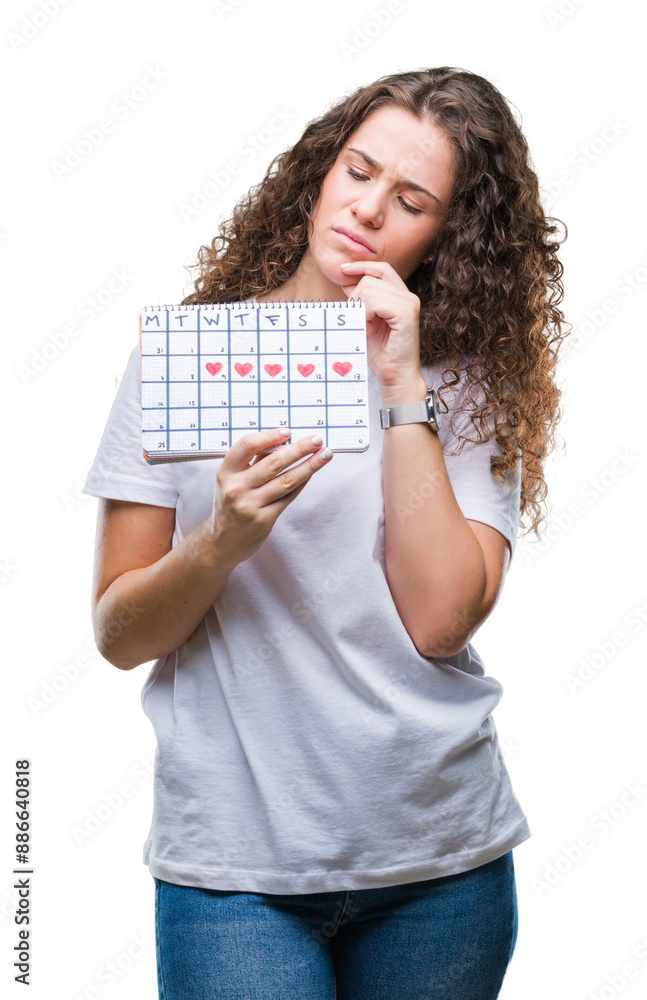 Sticker young brunette girl holding menstruation calendar over isolated background serious face thinking abo