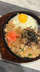 Yakimeshi fried rice with beef, seaweed, garlic and butter and toping with sliced green onion.