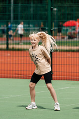 blonde girl dancing on the street