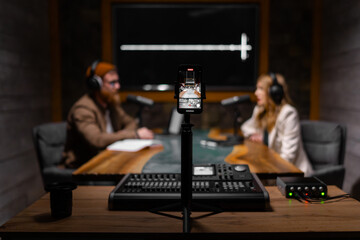 Professional podcast recording in modern studio with quality equipment for online broadcasting