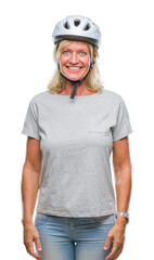 Middle age caucasian cyclist woman wearing safety helmet over isolated background with a happy and cool smile on face. Lucky person.