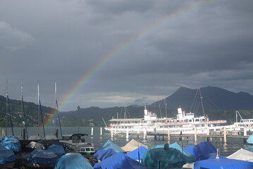 rainbow and boats in harbor, Luzern, Switzerland