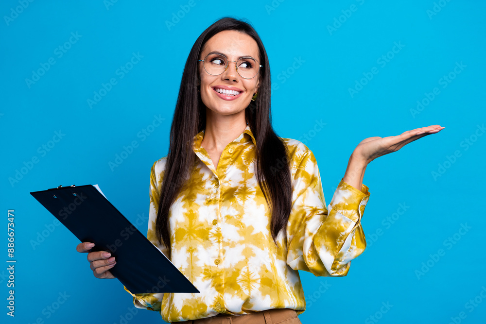 Sticker photo of elegant lovely woman wear trendy blouse presenting empty space isolated on blue color backg