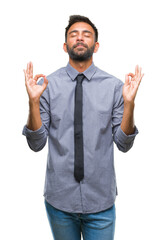 Fototapeta premium Adult hispanic business man over isolated background relax and smiling with eyes closed doing meditation gesture with fingers. Yoga concept.
