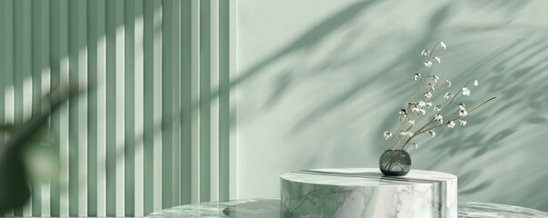 An elegant marble podium with silver veining, positioned in front of a pastel green wall. The soft and calming colors create a serene and sophisticated backdrop for showcasing products.