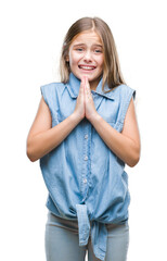 Young beautiful girl over isolated background begging and praying with hands together with hope...