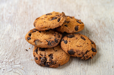 Chocolate chip cookies on wooden table. Selective focus, shallow depth of field.