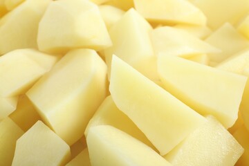 Peeled fresh raw potatoes as background, closeup