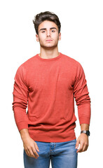 Fototapeta premium Young handsome man over isolated background Relaxed with serious expression on face. Simple and natural looking at the camera.