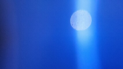 Abstract background Flat style. Freeform blue gradient color background with defocused blur and noise effects. Light and dark blue colors copy space text area. White circle light