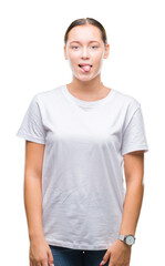 Young beautiful caucasian woman over isolated background sticking tongue out happy with funny expression. Emotion concept.