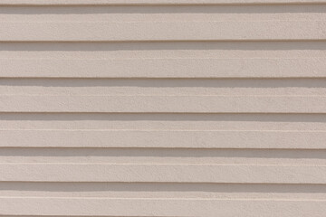 Beige Textured Wall with Horizontal Lines for Background or Architectural Design