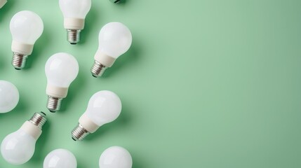 Retail boxed LED bulbs eco friendly and energy efficient on green backdrop with copy space top down view