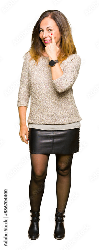 Wall mural beautiful middle age woman wearing fashion sweater pointing to the eye watching you gesture, suspici