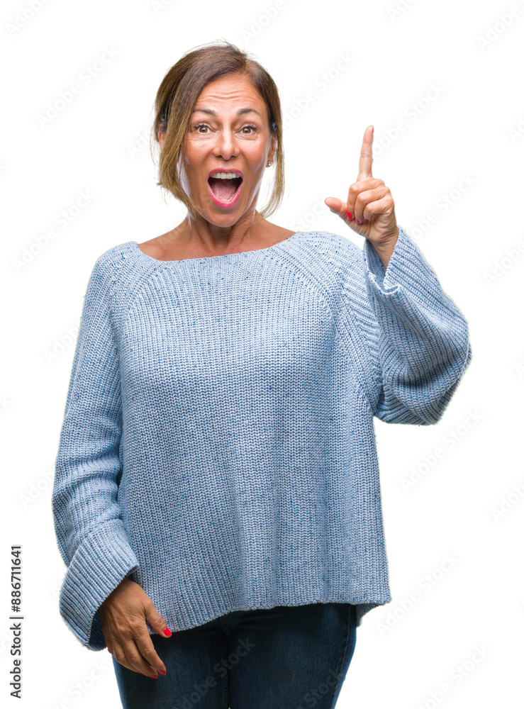 Canvas Prints middle age senior hispanic woman wearing winter sweater over isolated background pointing finger up 