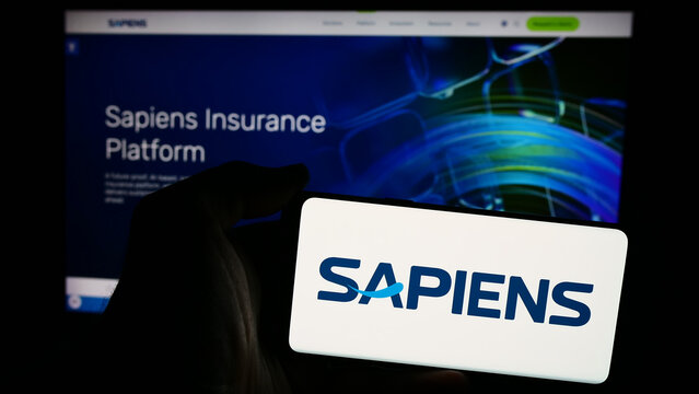 Stuttgart, Germany - 07-08-2024: Person holding smartphone with logo of Israeli company Sapiens International Corporation N.V. in front of website. Focus on phone display.