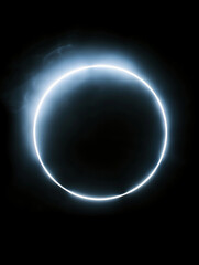  A glowing neon circle against a dark background.