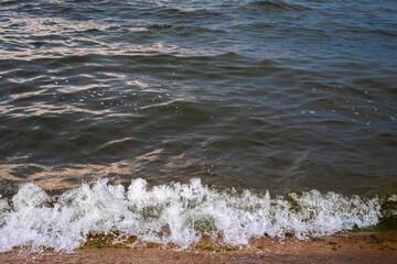 A wave from the river splashing