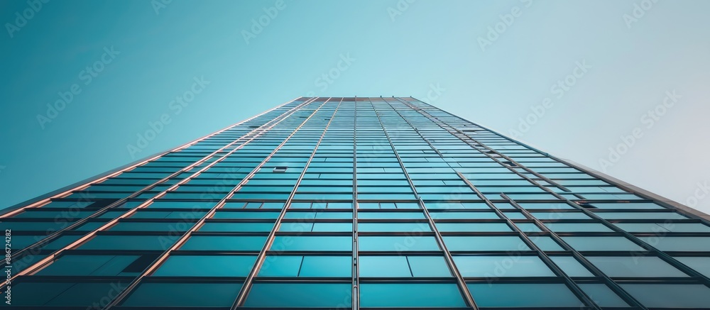 Poster view of a tall building against a clear sky with copy space image