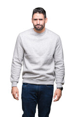 Young handsome man wearing sweatshirt over isolated background depressed and worry for distress, crying angry and afraid. Sad expression.