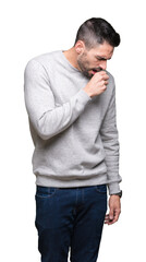 Young handsome man wearing sweatshirt over isolated background feeling unwell and coughing as...