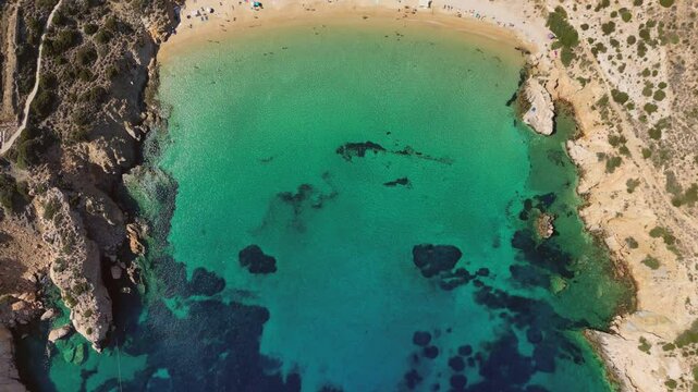 An aerial view of the turquoise waters of famous Kedros beach on Donousa Island in the Cyclades, Greece.