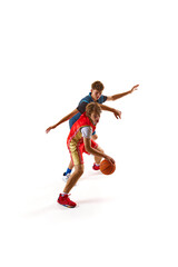 Player in red jersey demonstrates quick footwork and ball control, evading defender in blue who attempting to block his advance against white studio background. Concept of sport, competition, match.