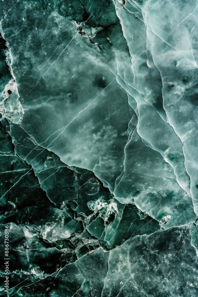 Poster close-up shot of unique green marble surface with textured pattern. irregularly shaped stones create
