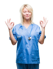 Young beautiful blonde doctor woman wearing medical uniform over isolated background relax and smiling with eyes closed doing meditation gesture with fingers. Yoga concept.