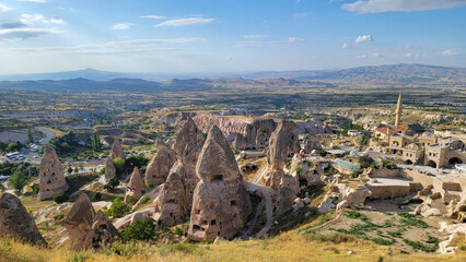 View of a town in the rock, being triangular in shape and some mountains in the distance