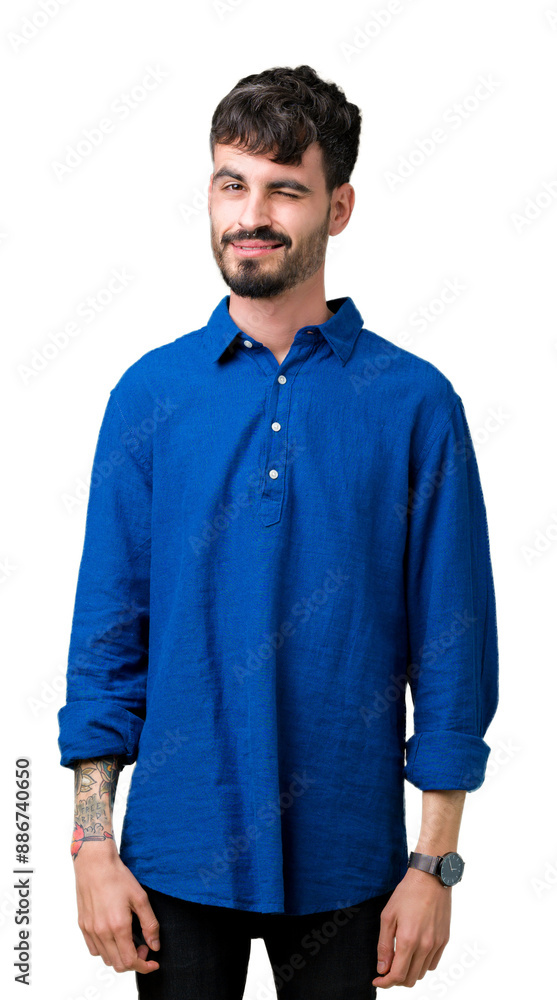 Canvas Prints Young handsome man over isolated background winking looking at the camera with sexy expression, cheerful and happy face.