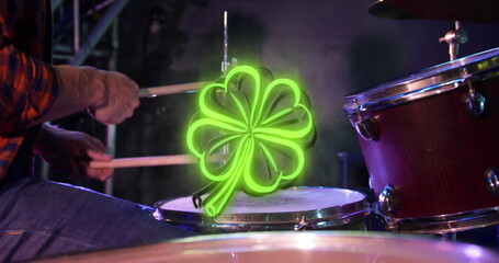 Image of st patrick's day green shamrock neon over drummer on stage © vectorfusionart