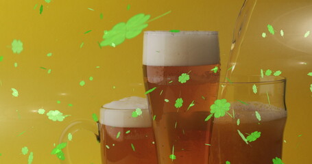 Image of st patrick's day green shamrock falling over beer glasses © vectorfusionart