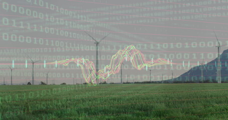 Image of binary coding and against spinning windmills on grassland